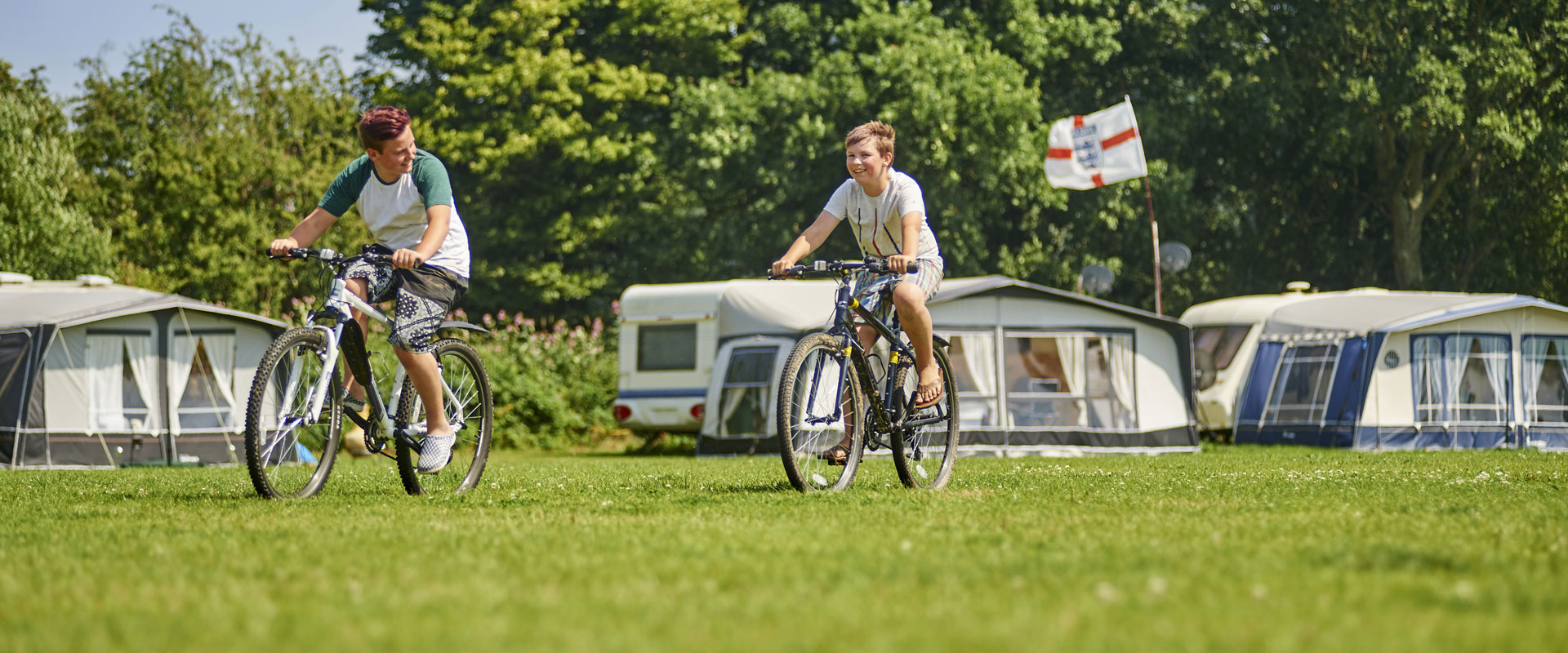Image of a familcy on holiday at park farm campsite